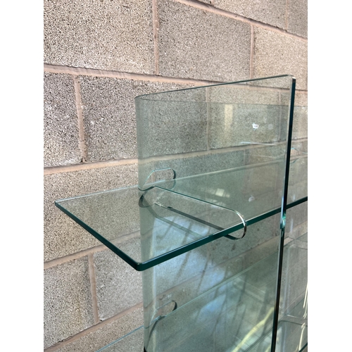 31 - A modern tempered glass four tier shelving unit - approx. 156cm high x 120cm wide x 40cm deep