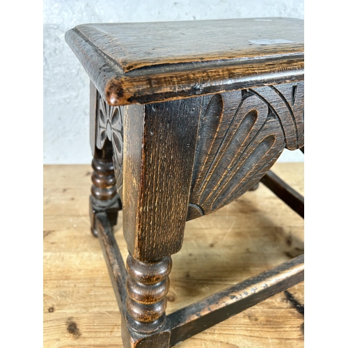 35 - A 17th century style carved oak rectangular joint stool with turned supports - approx. 40cm high x 3... 