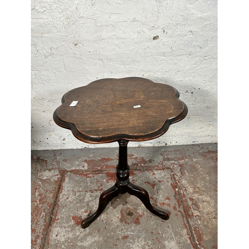 4 - A 19th century oak tripod occasional table - approx. 67cm high x 50cm diameter