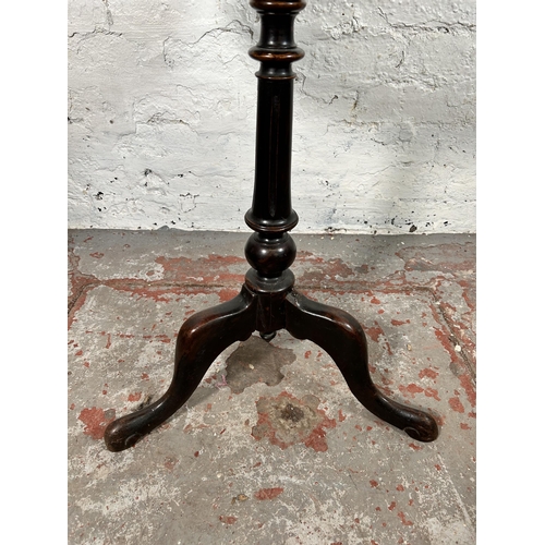 4 - A 19th century oak tripod occasional table - approx. 67cm high x 50cm diameter