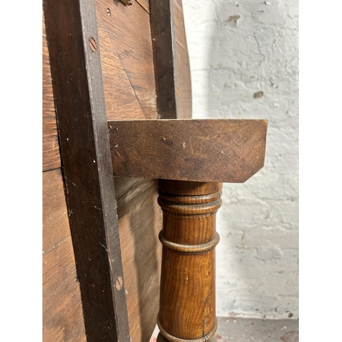 5 - A 19th century oak circular tilt top occasional table - approx. 117cm high x 78cm diameter