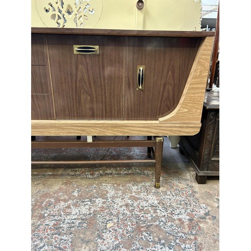 38 - A mid 20th century melamine sideboard with three central drawers and three cupboard doors - approx. ... 