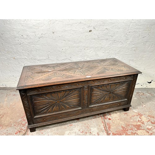 40 - A 17th century style carved oak blanket box - approx. 49cm high x 107cm wide x 45cm deep