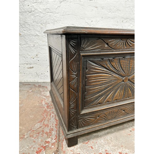 40 - A 17th century style carved oak blanket box - approx. 49cm high x 107cm wide x 45cm deep