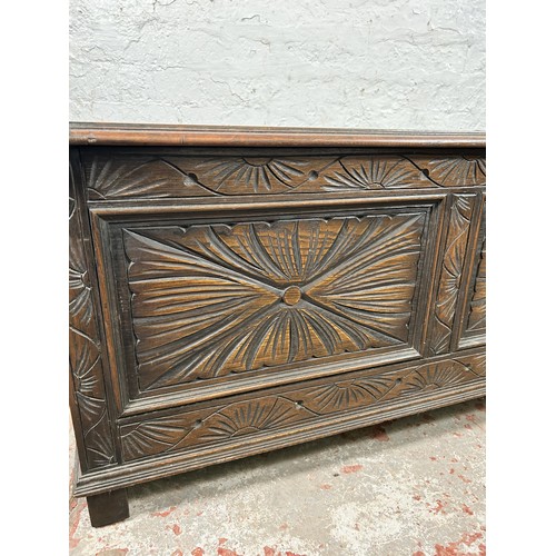 40 - A 17th century style carved oak blanket box - approx. 49cm high x 107cm wide x 45cm deep