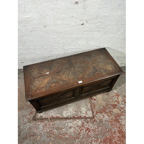 40 - A 17th century style carved oak blanket box - approx. 49cm high x 107cm wide x 45cm deep