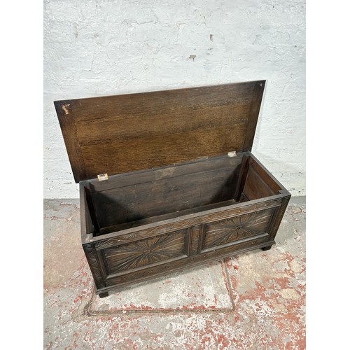 40 - A 17th century style carved oak blanket box - approx. 49cm high x 107cm wide x 45cm deep