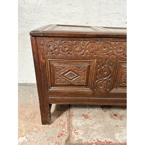 47 - A carved oak blanket box with later added interior and carving - approx. 73cm high x 132cm wide x 58... 