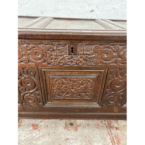 47 - A carved oak blanket box with later added interior and carving - approx. 73cm high x 132cm wide x 58... 