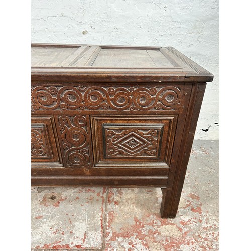 47 - A carved oak blanket box with later added interior and carving - approx. 73cm high x 132cm wide x 58... 