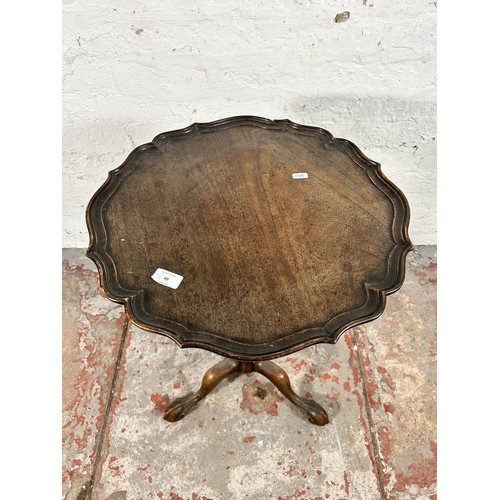 49 - A George III style mahogany serpentine tripod occasional table with ball and claw supports - approx.... 