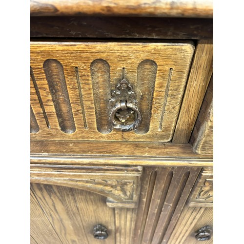 52 - A Priory style carved oak dresser - approx. 180cm high x 122cm wide x 47cm deep