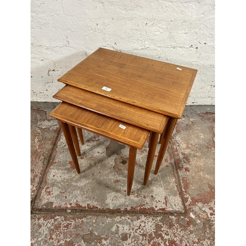 100 - A mid 20th century teak nest of three tables - approx. 49cm high x 55cm wide x 38cm deep