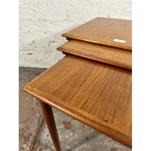 100 - A mid 20th century teak nest of three tables - approx. 49cm high x 55cm wide x 38cm deep