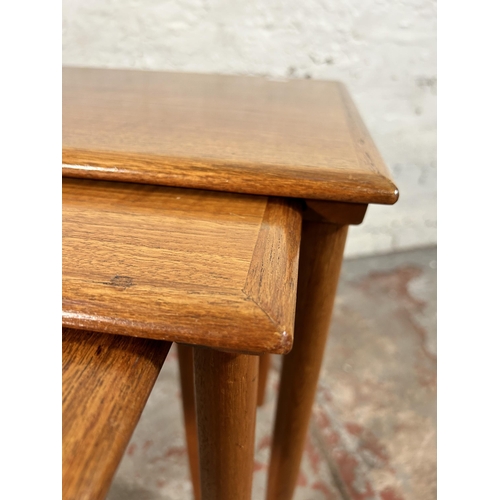 100 - A mid 20th century teak nest of three tables - approx. 49cm high x 55cm wide x 38cm deep