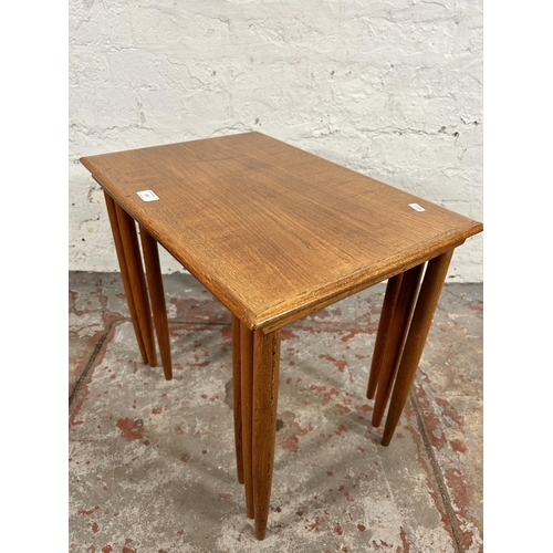 100 - A mid 20th century teak nest of three tables - approx. 49cm high x 55cm wide x 38cm deep