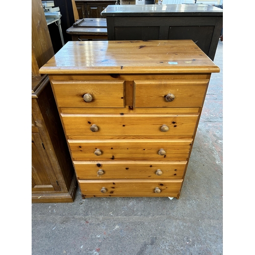 104 - A modern pine chest of two short over four long drawers - approx. 102cm high x 76cm wide x 45cm deep