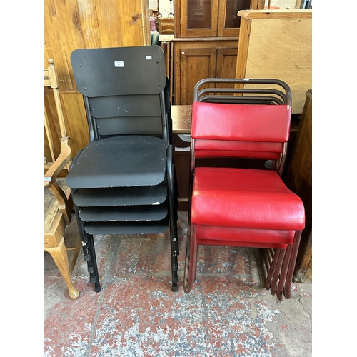 108 - Eight stacking chairs, four black metal and four red vinyl and tubular metal