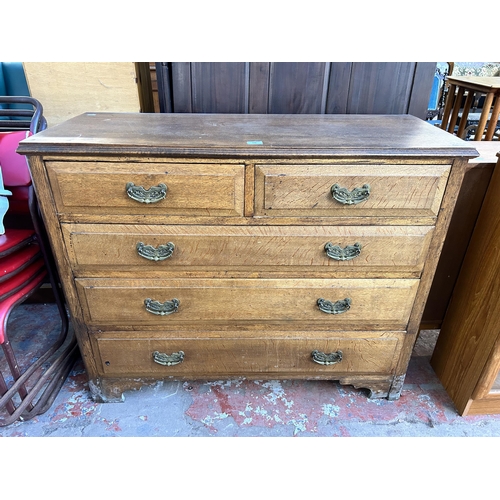 110 - A late 19th/early 20th century oak chest of two short over three long drawers with bracket supports ... 