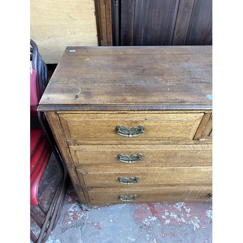 110 - A late 19th/early 20th century oak chest of two short over three long drawers with bracket supports ... 