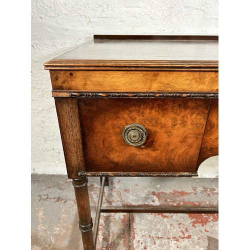 117 - A Waring & Gillow Ltd. walnut dressing table with three drawers, patent no. 224089 - approx. 77cm hi... 