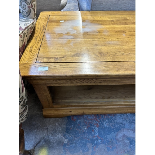 124 - A modern solid oak rectangular two tier coffee table - approx. 46cm high x 60cm wide x 110cm long