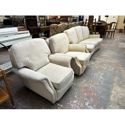 133 - A fabric upholstered three piece lounge suite comprising three seater sofa and two armchairs