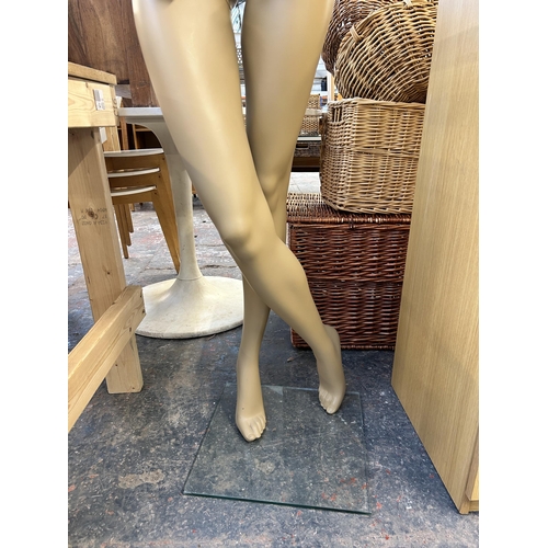 140 - A female shop display mannequin - approx. 167cm high