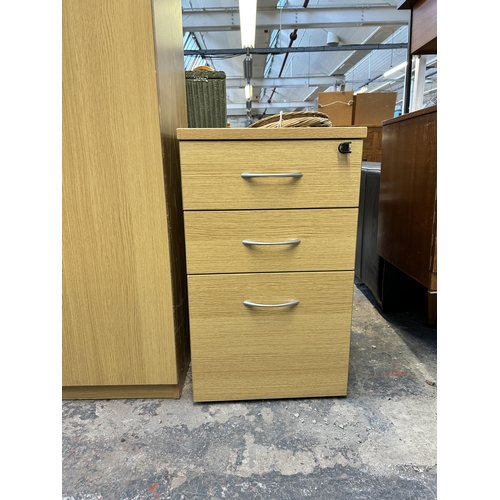 142 - Two pieces of modern oak effect office furniture, one two door cabinet and one three drawer filing c... 