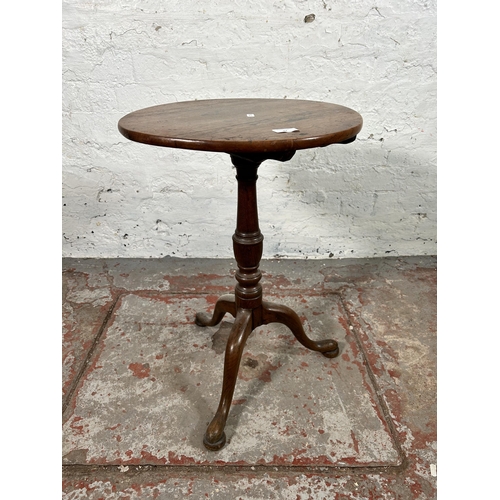 67 - A 19th century oak tilt top table on tripod pedestal support - approx. 86cm high x 44cm wide x 41cm ... 