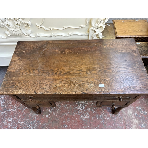 68 - A Goodalls of Manchester oak writing desk - approx. 77cm high x 107cm wide x 53cm deep