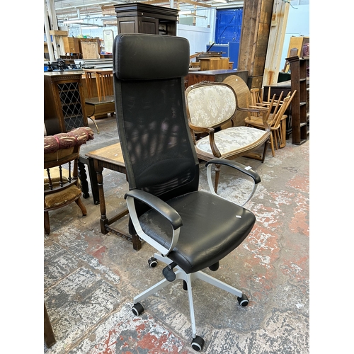 75 - An IKEA Markus swivel office desk chair