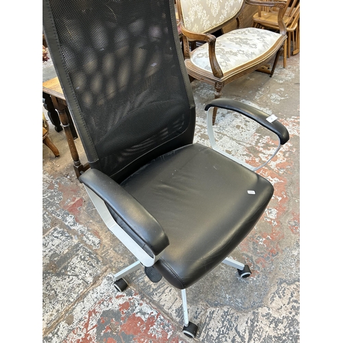 75 - An IKEA Markus swivel office desk chair