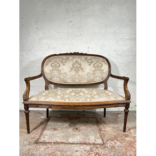 77 - A late 19th/early 20th century carved mahogany and floral upholstered two seater parlour sofa - appr... 