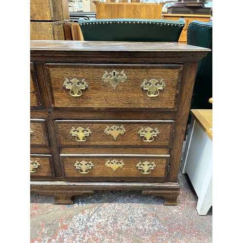 79 - A George III Lancashire oak and mahogany crossbanded sideboard with five drawers, two cupboard doors... 