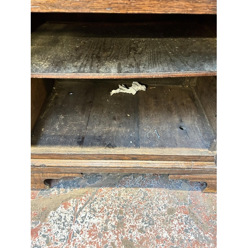 79 - A George III Lancashire oak and mahogany crossbanded sideboard with five drawers, two cupboard doors... 