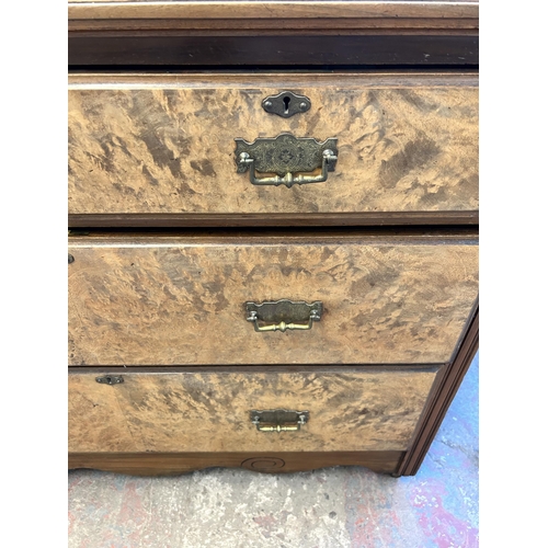 83 - An Edwardian walnut chest of two short over two long drawers - approx. 85cm high x 107cm wide x 49cm... 