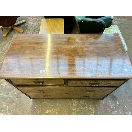 83 - An Edwardian walnut chest of two short over two long drawers - approx. 85cm high x 107cm wide x 49cm... 