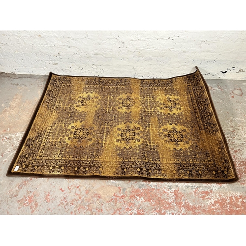 91 - A Plantation Rug Company brown rug - approx. 170cm x 117cm