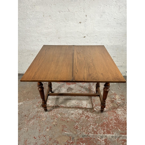 92 - A Simpson & Sons Halifax walnut rectangular games table - approx. 77cm high x 84cm wide x 44cm deep