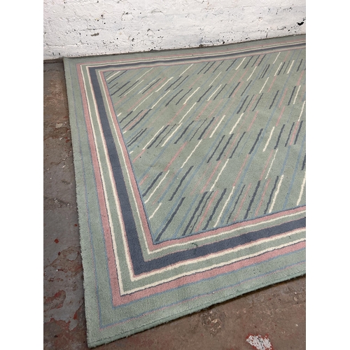 94 - A Belgian Fashion Wilton rug - approx. 290cm x 190cm