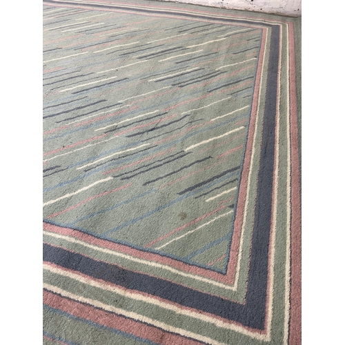 94 - A Belgian Fashion Wilton rug - approx. 290cm x 190cm