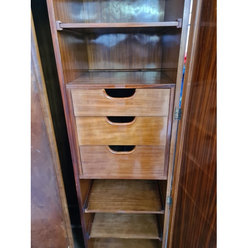 170 - An Art Deco walnut double wardrobe with fitted interior