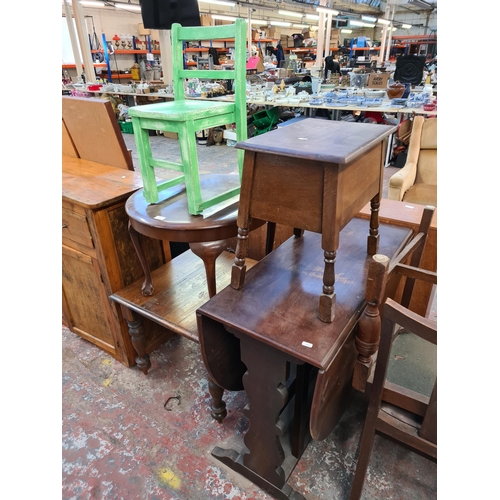 160 - Eleven pieces of furniture to include carved oak sewing table, walnut circular coffee table, oak dro... 