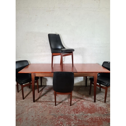 167 - A 1960s Younger teak extending rectangular dining table and four teak blank vinyl dining chairs - ta... 