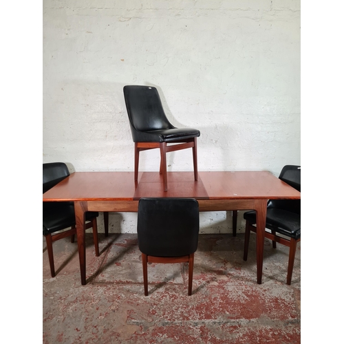 167 - A 1960s Younger teak extending rectangular dining table and four teak blank vinyl dining chairs - ta... 