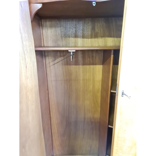 172 - A bird's eye maple three piece bedroom suite comprising double wardrobe, single wardrobe and dressin... 