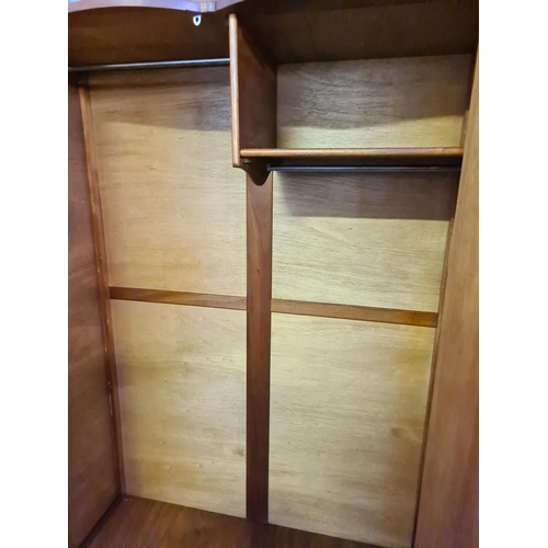 172 - A bird's eye maple three piece bedroom suite comprising double wardrobe, single wardrobe and dressin... 