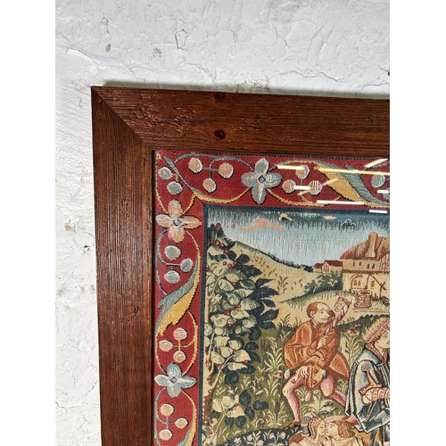 191 - A framed tapestry of a Medieval scene - approx. 72cm high x 90cm wide