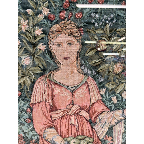 192 - A framed Arts and Crafts style tapestry of a lady holding apples - approx. 76cm high x 48cm wide